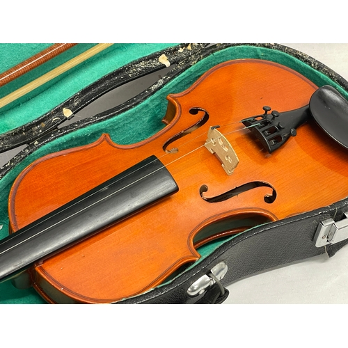 534 - A Violin in case.