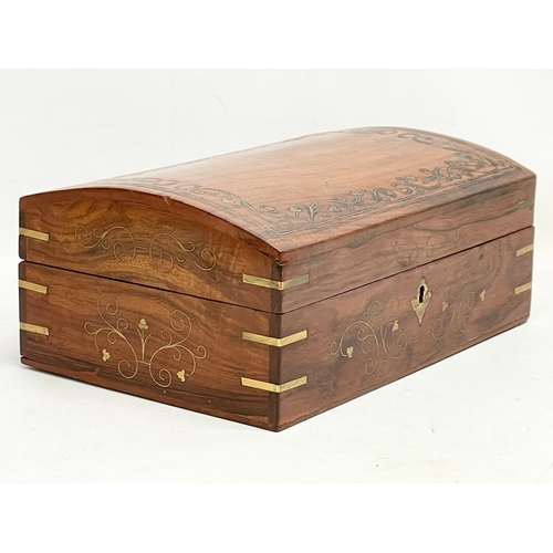 205 - A brass inlaid Indian rosewood dome top jewellery box. 30.5x20.5x13cm.