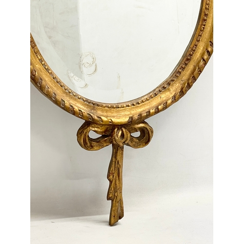 50 - A pair of good quality 18th century style gilt framed bevelled mirrors. 47x106cm