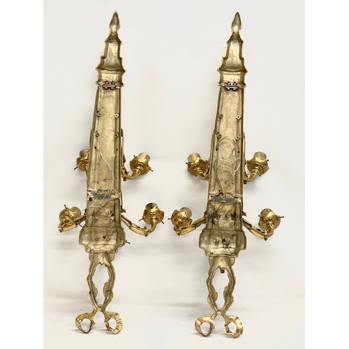 55 - A pair of large heavy ornate brass wall sconces. 33x92.5cm