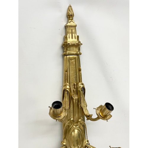 55 - A pair of large heavy ornate brass wall sconces. 33x92.5cm