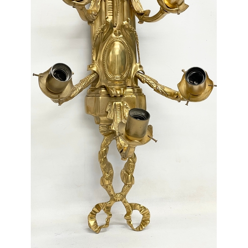 55 - A pair of large heavy ornate brass wall sconces. 33x92.5cm