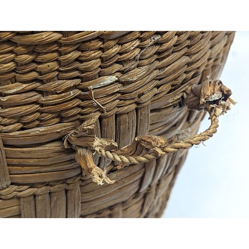 14 - 2 1970s Mid Century wicker 2 handled hampers. Largest measures 48x59cm