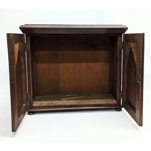 10 - A Mid Victorian mahogany table top cabinet. 49x21x42.5cm