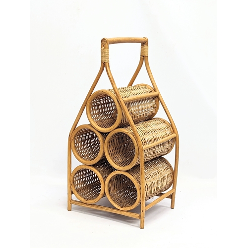 140 - A Mid Century bamboo magazine rack with a Mid Century wicker wine holder. Magazine rack measures 42x... 