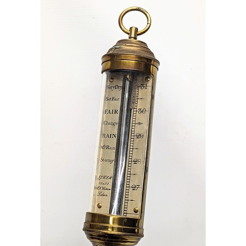 16 - A vintage brass ships barometer. 98cm