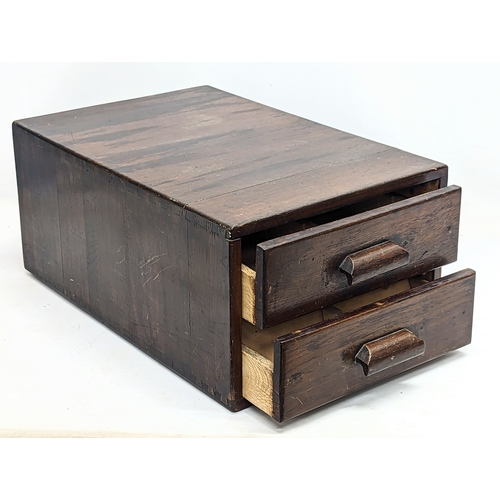 141 - A vintage oak table top filing cabinet. 34x55x24cm