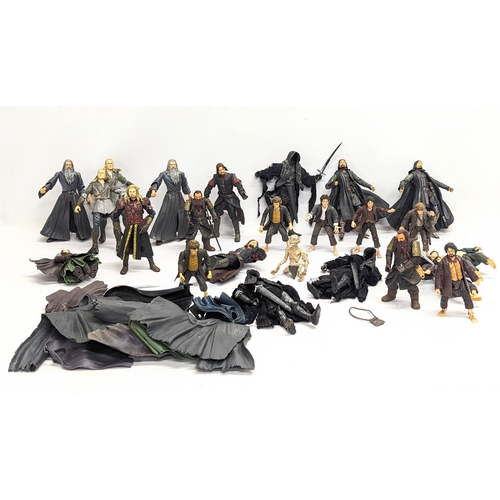 556 - A collection of The Lord of The Rings toy figures by Marvel, including Aragorn, Gandalf, Boromir, Le... 