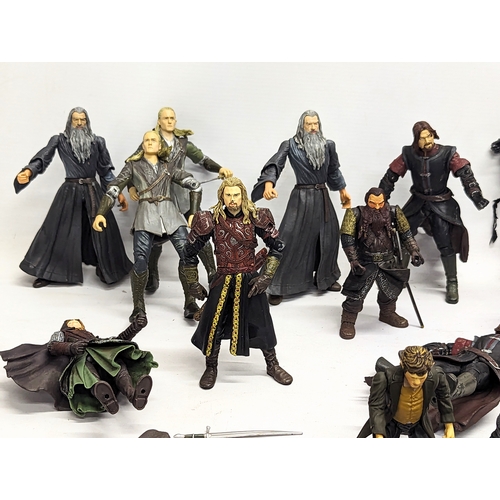 556 - A collection of The Lord of The Rings toy figures by Marvel, including Aragorn, Gandalf, Boromir, Le... 