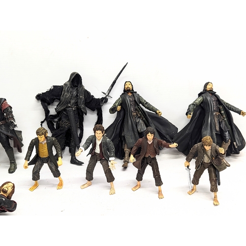 556 - A collection of The Lord of The Rings toy figures by Marvel, including Aragorn, Gandalf, Boromir, Le... 