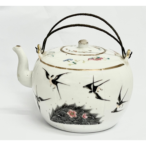 667 - An early 20th century Chinese Qing Famille Rose teapot. 15cm