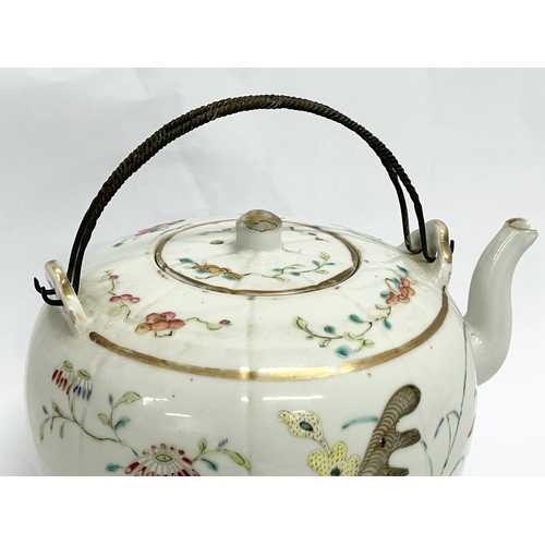 667 - An early 20th century Chinese Qing Famille Rose teapot. 15cm