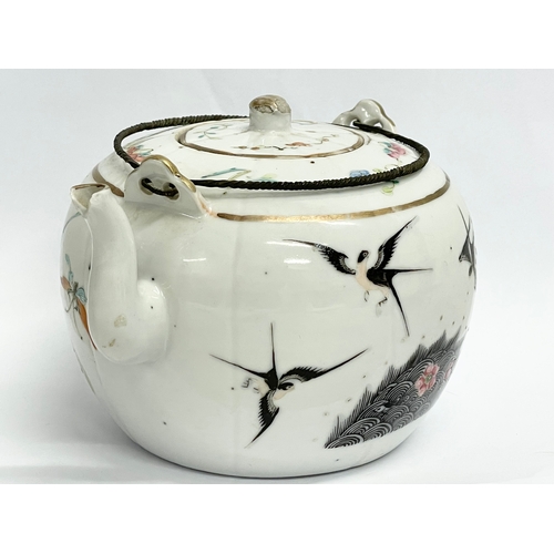 667 - An early 20th century Chinese Qing Famille Rose teapot. 15cm