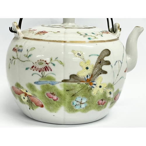 667 - An early 20th century Chinese Qing Famille Rose teapot. 15cm