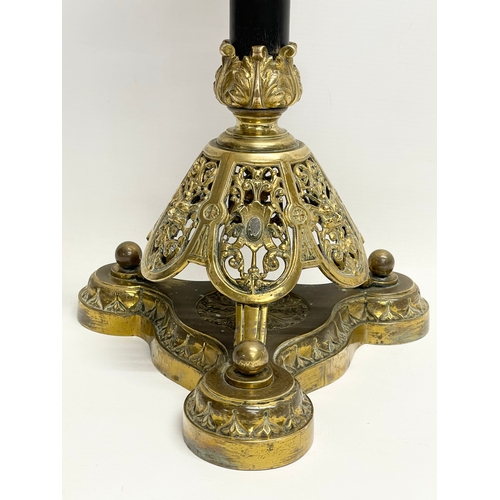 146 - A large good quality Victorian ornate brass oil lamp, with an etched Cranberry Glass shade. 80cm