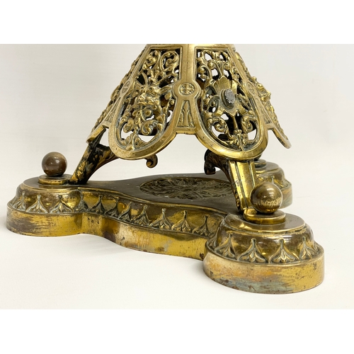 146 - A large good quality Victorian ornate brass oil lamp, with an etched Cranberry Glass shade. 80cm