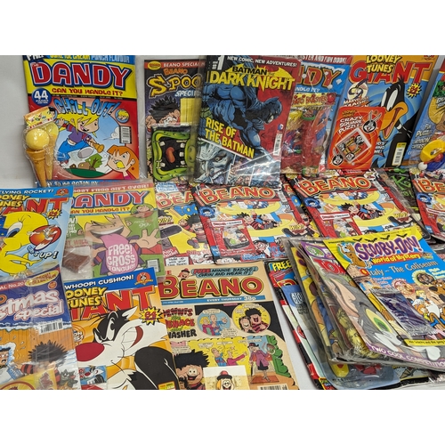 560 - A quantity of Beano, Dandy, Looney Tunes, Batman Scooby-Doo magazines, etc.