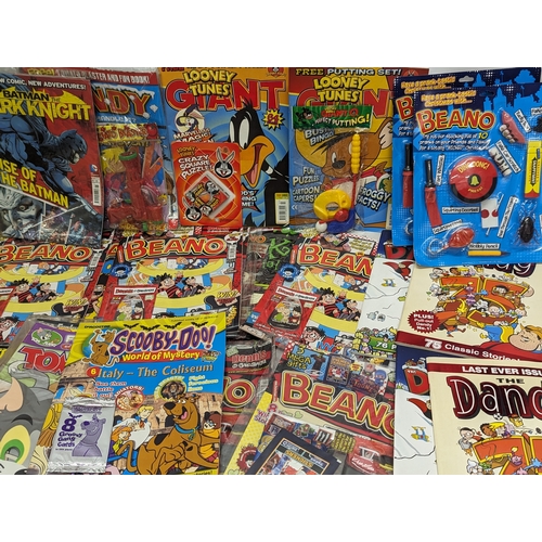 560 - A quantity of Beano, Dandy, Looney Tunes, Batman Scooby-Doo magazines, etc.