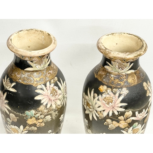 668 - A pair of late 19th century Japanese Satsuma pottery vases. 27cm