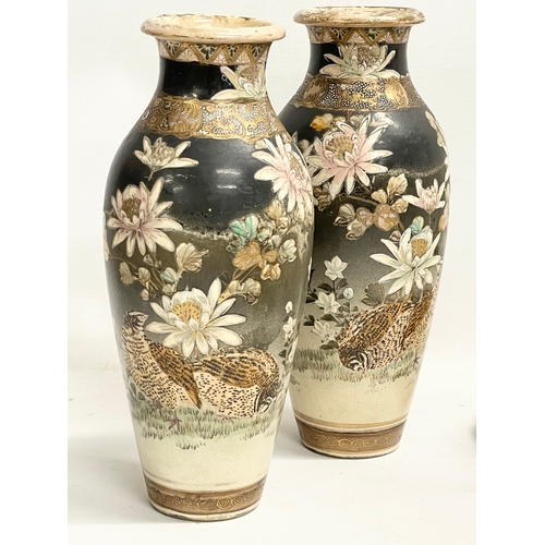 668 - A pair of late 19th century Japanese Satsuma pottery vases. 27cm