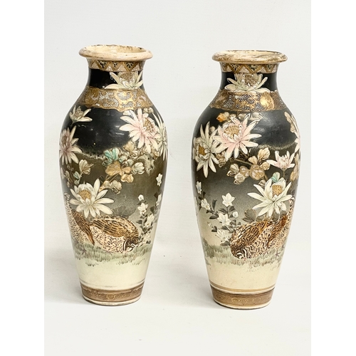 668 - A pair of late 19th century Japanese Satsuma pottery vases. 27cm