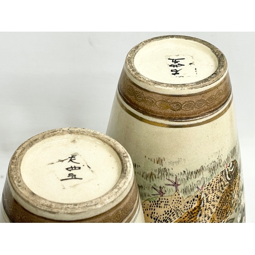 668 - A pair of late 19th century Japanese Satsuma pottery vases. 27cm