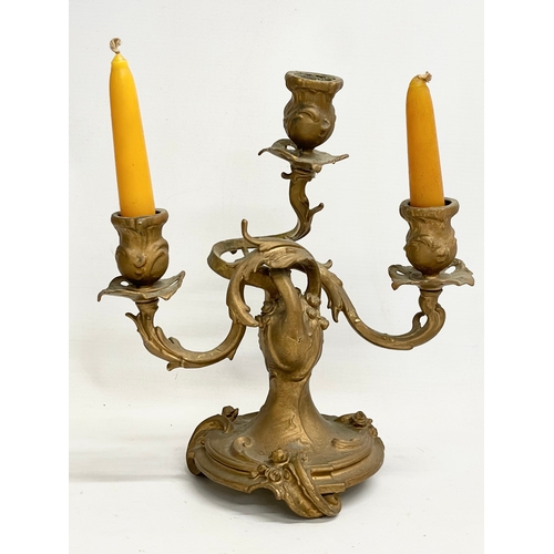 45 - A pair of late 19th century gilt candelabras in the Rococo style. 25x28cm