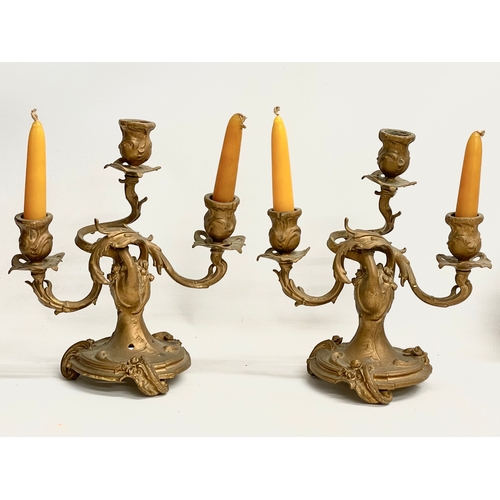 45 - A pair of late 19th century gilt candelabras in the Rococo style. 25x28cm