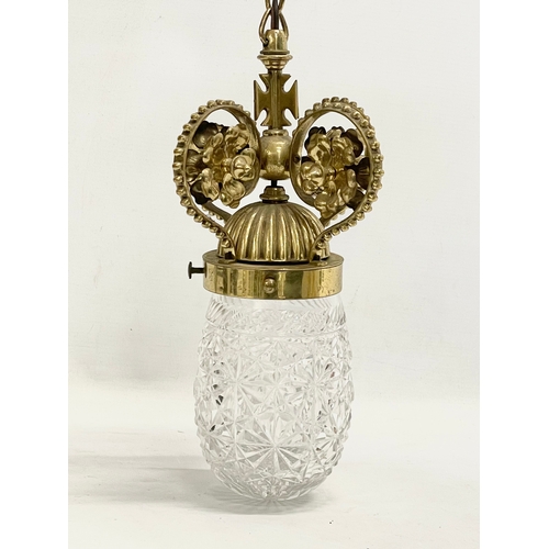 49 - An early 20th century ornate brass porch light with crystal shade. 41cm