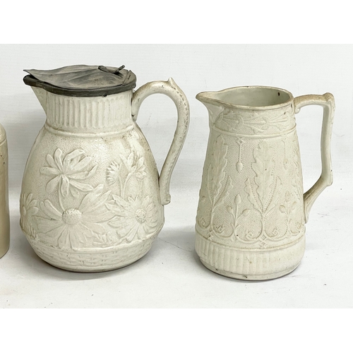 628 - A quantity of Victorian salt glazed pottery and stoneware jugs and jars. Including a Victorian Brown... 