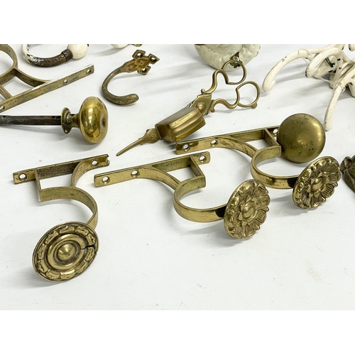 60 - A quantity of Victorian and early 20th century hooks and handles etc.