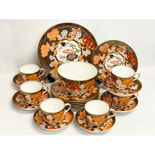 634 - A 20 piece Royal Crown Derby Imari pattern porcelain tea set. Largest plate measures 23.5cm. Sugar b... 