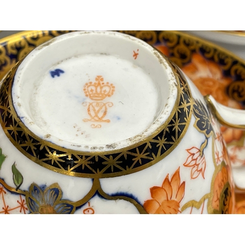 634 - A 20 piece Royal Crown Derby Imari pattern porcelain tea set. Largest plate measures 23.5cm. Sugar b... 