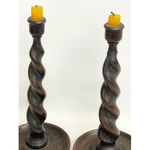 156 - A pair of tall early 20th century oak Barley Twist candlesticks. Circa 1910-1920. 30cm