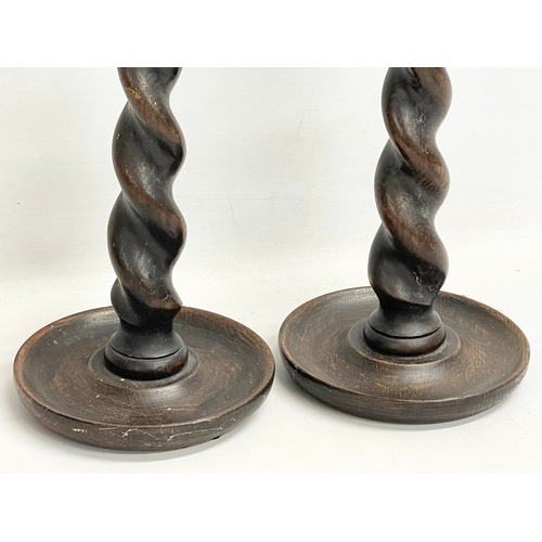 156 - A pair of tall early 20th century oak Barley Twist candlesticks. Circa 1910-1920. 30cm