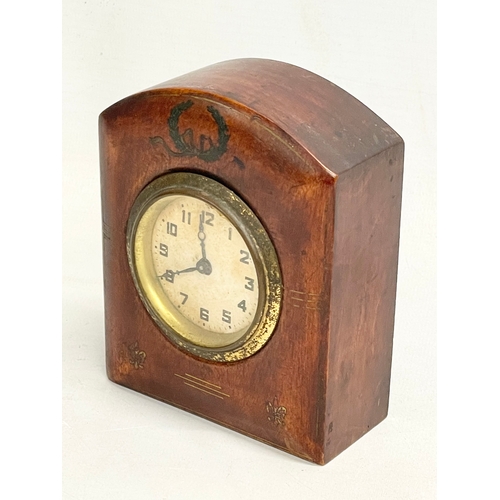 158 - An early 20th century inlaid windup mantle clock. 9.5x12cm