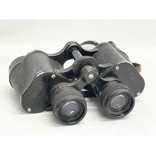 563 - A pair of binoculars in leather case.