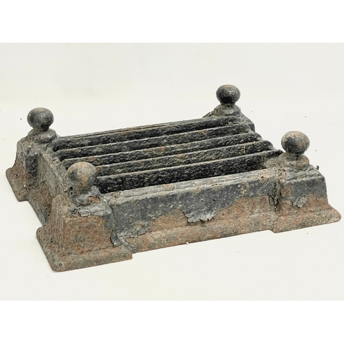 62 - A Victorian cast iron boot scraper. 35.5x28x10.5cm