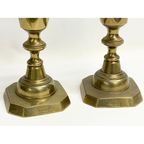 635 - A pair of large Victorian brass candlesticks. The King of Diamonds. 31.5cm.