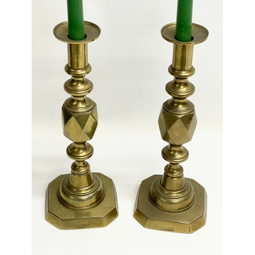 635 - A pair of large Victorian brass candlesticks. The King of Diamonds. 31.5cm.