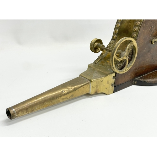 93 - A 19th century brass mechanical bellows. 68cm.