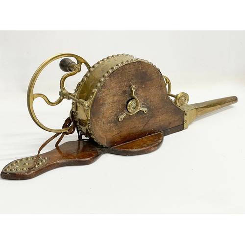 93 - A 19th century brass mechanical bellows. 68cm.