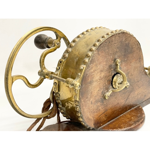 93 - A 19th century brass mechanical bellows. 68cm.