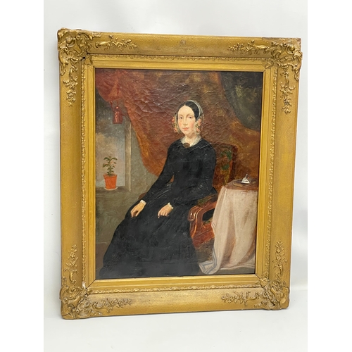 65 - A pair of large mid 19th century oil paintings of a lady and gentleman, in original ornate gilt fram... 