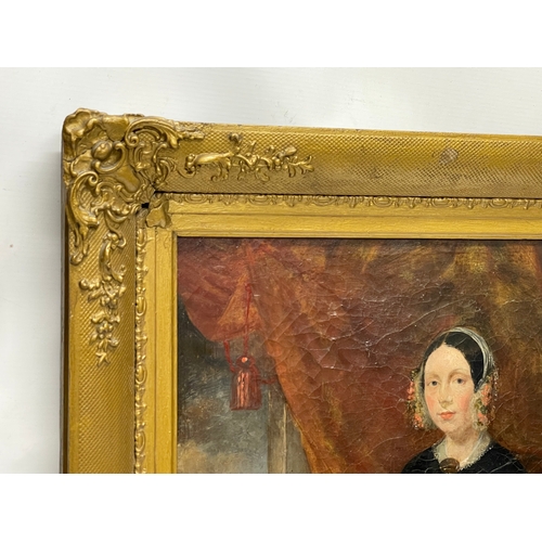 65 - A pair of large mid 19th century oil paintings of a lady and gentleman, in original ornate gilt fram... 