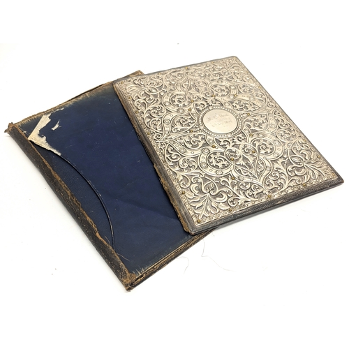 758 - A large ornate silver document folder. 22x29.5cm