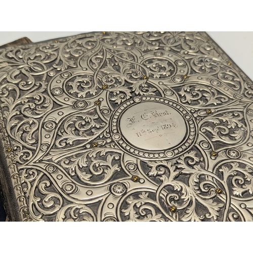 758 - A large ornate silver document folder. 22x29.5cm