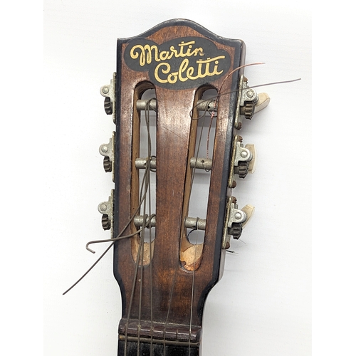 593 - A vintage acoustic guitar.