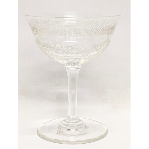 670 - A set 9 early 20th century etched drinking glasses. 11.5cm