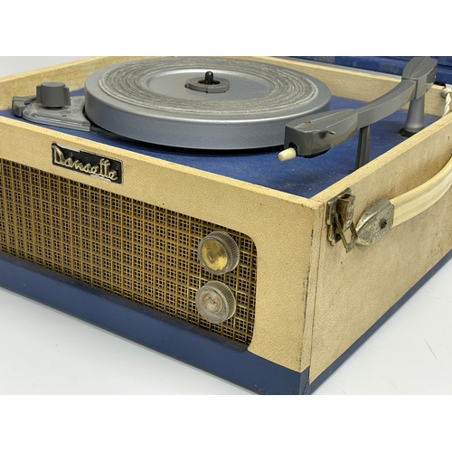 565 - A vintage Dansette record player. 34x31.5x18.5cm